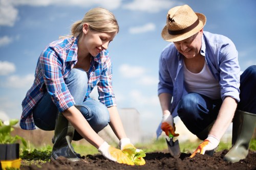 Gardener assessing a backyard garden with clipboard for safety and insurance documentation